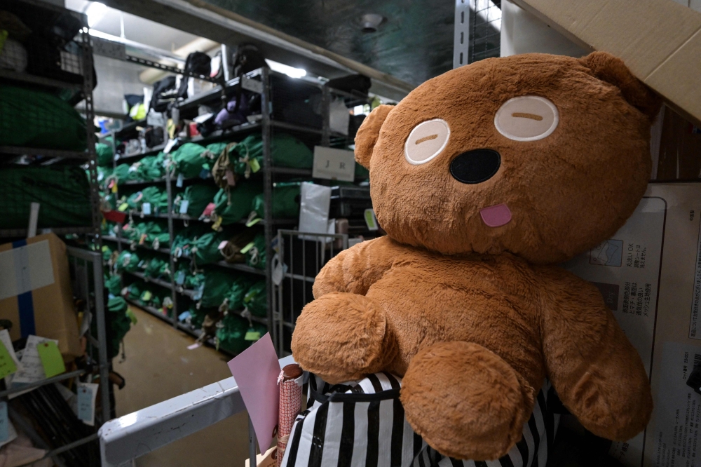 A teddy bear amongst thousands of items — all bagged, tagged and organised based on where and when they were lost — at the Tokyo Metropolitan Police Department Lost and Found Centre in the Iidabashi area of central Tokyo August 2, 2024. — AFP pic