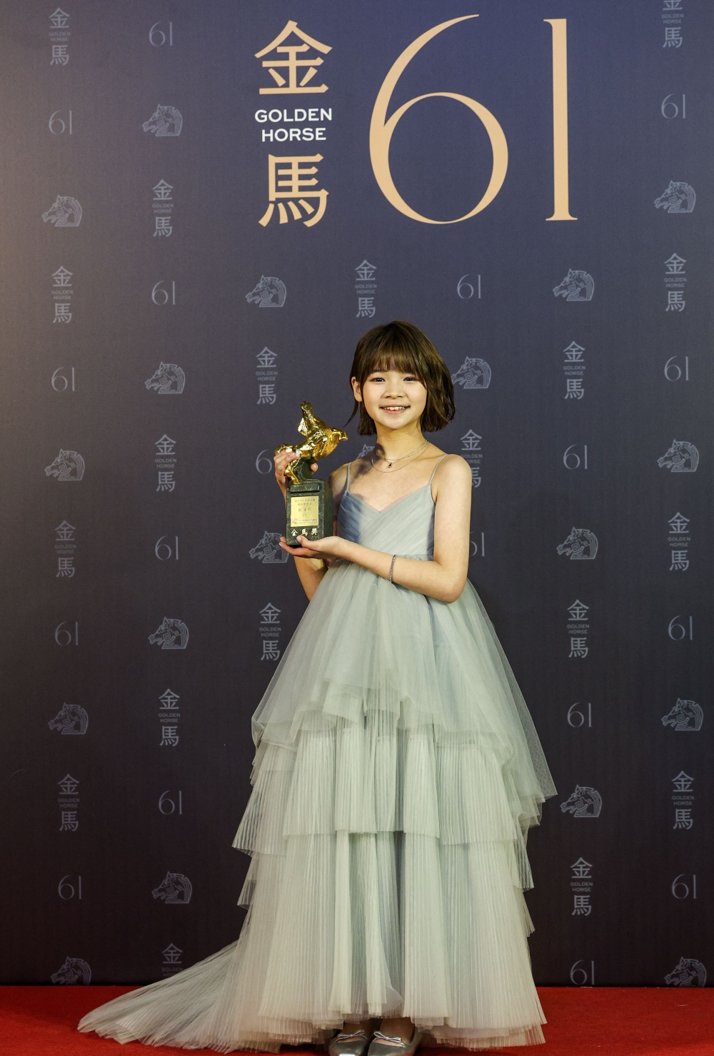 Taiwanese actress Feifei Cheng poses after winning the best new performer, at Taiwan's 61th Golden Horse film awards ceremony in Taipei November 23, 2024. — AFP pic