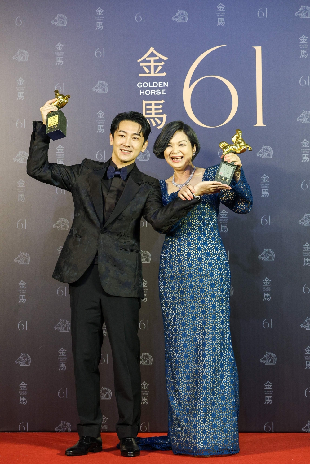 Taiwanese actors Shih Ming-shuai and Yang Kuei-mei pose after winning best supporting roles, at Taiwan's 61th Golden Horse film awards ceremony in Taipei November 23, 2024. — AFP pic