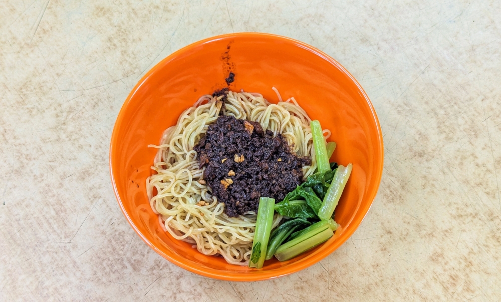 Just one bowl of his minced pork noodles is never enough. — Picture by Ethan Lau