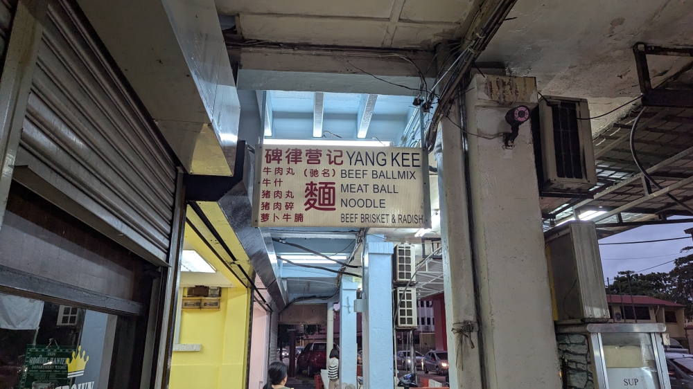 The original ‘Yang Kee’ sign still hangs before the current Jalan Peel shop. — Picture by Ethan Lau