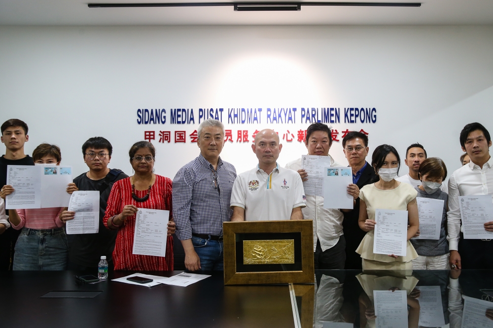 Kepong MP Lim Lip Eng (centre) with those who made police reports claiming to be scammed after a press conference in Kepong November 24, 2024. — Picture by Yusof Mat Isa