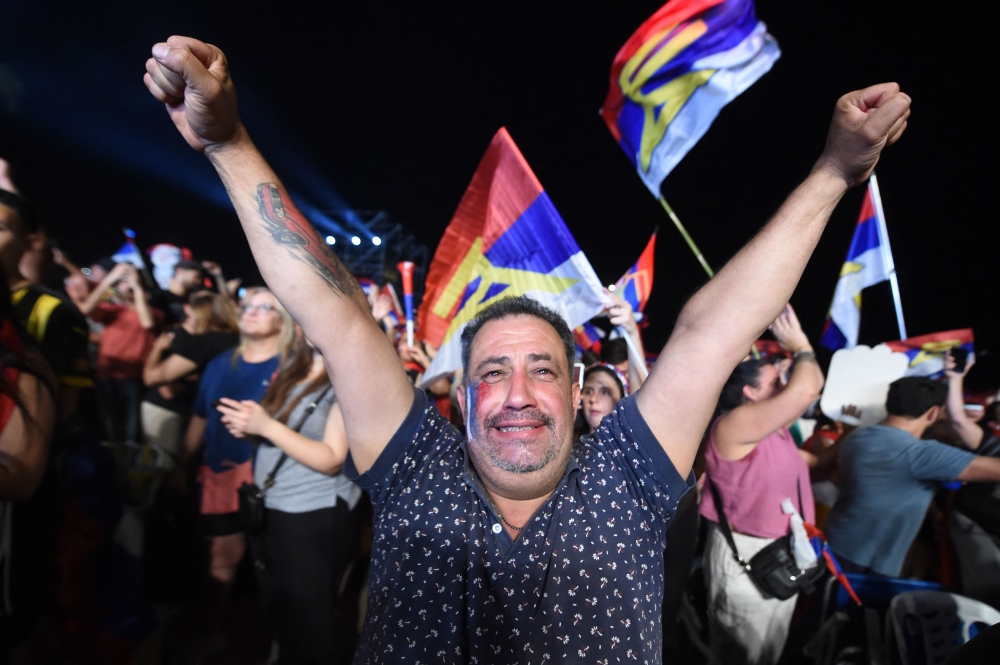 A supporter of Uruguay's president-elect, Yamandu Orsi, of the Frente Amplio coalition, celebrates after the presidential runoff election in Montevideo on November 24, 2024. — AFP pic