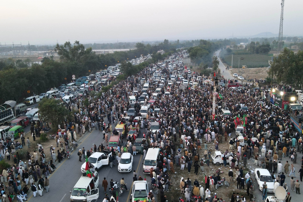 Supporters of jailed former Pakistan's prime minister Imran Khan's Pakistan Tehreek-e-Insaf (PTI) party gather during a protest demanding his release, in Swabi November 24, 2024. — AFP pic