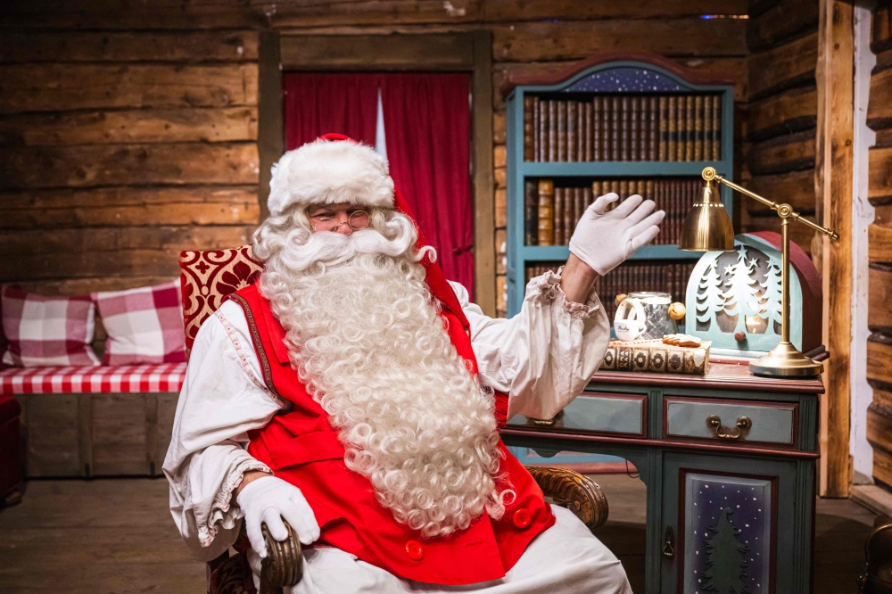 “Santa Claus” waves at his office in the Santa Park near Rovaniemi, Finnish Lapland, on November 16, 2024. — AFP pic