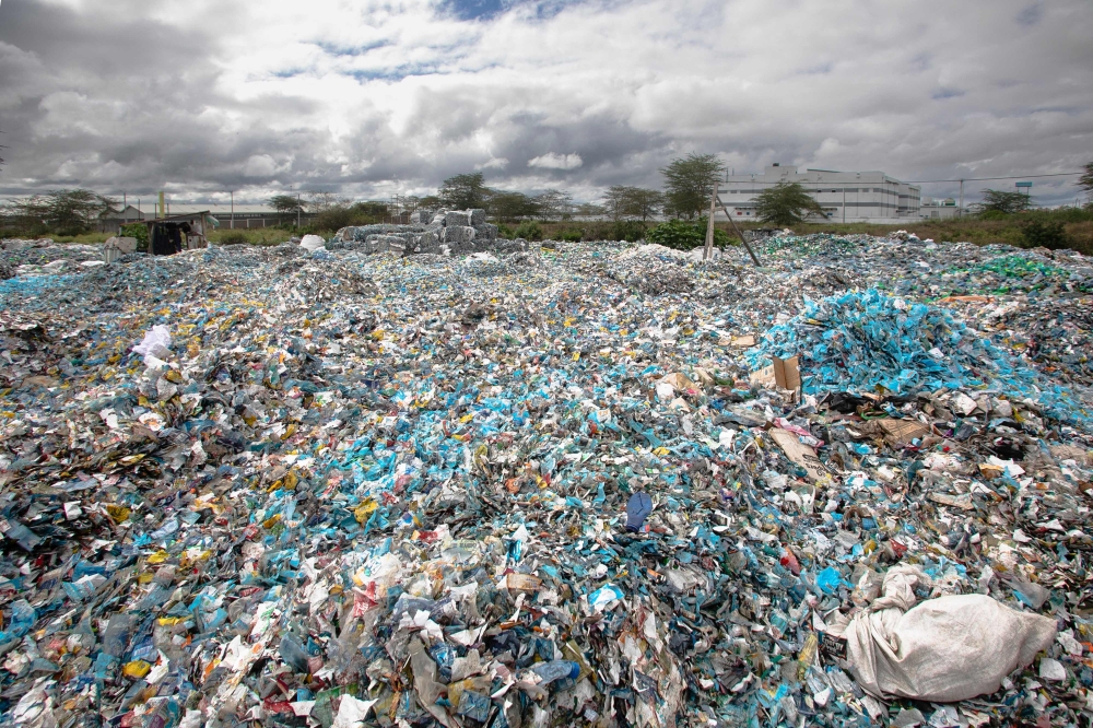 A mound of plastic waste scavenged from various environments including river channels and dump sites sit in the yard at T3 (EPZ) Limited, a recycling and repurposing factory in Athi River town, Machakos county on November 13, 2023. — AFP pic