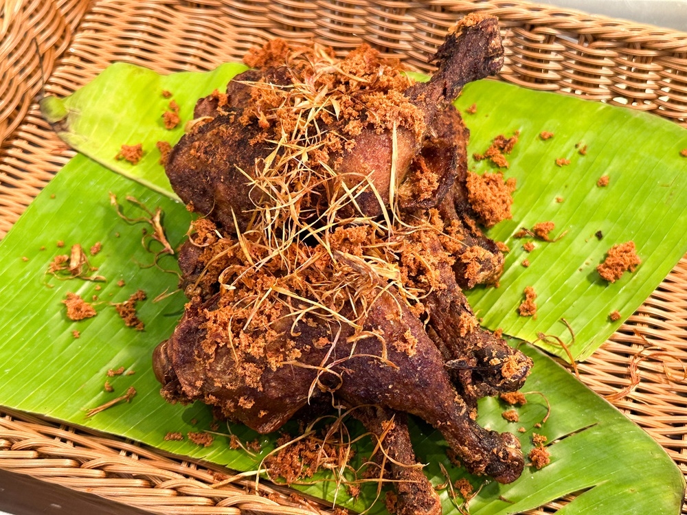 Similar to ‘ayam berempah goreng’, the Indonesian Ayam Kalasan is juicy and topped with crumbs of fried batter. — Picture by Lee Khang Yi