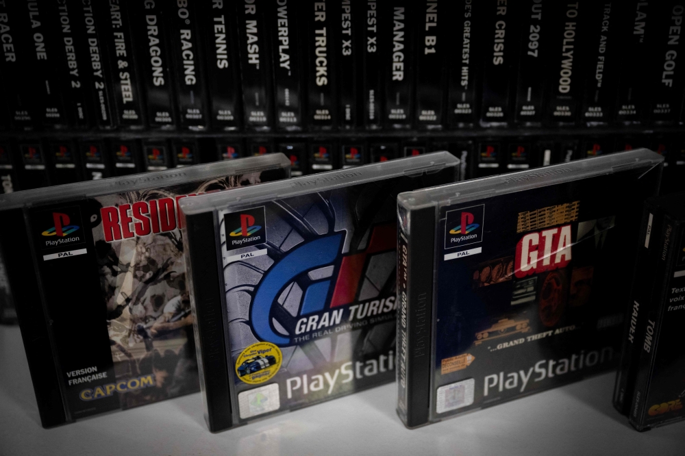 This photograph shows PlayStation 1 games on a shelf, in Vraiville, northern France, on November 20, 2024. A global success, particularly with a more adult audience, which has propelled the Japanese manufacturer to the rank of major player in the sector. — AFP pic