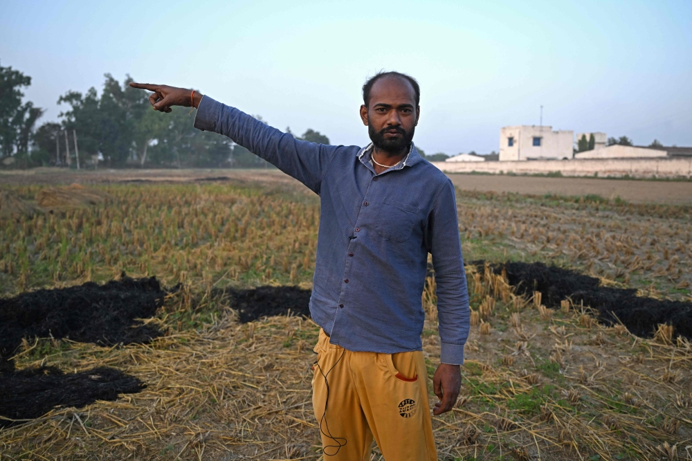 In this photograph taken on November 26, 2024, Indian farmer Ajay Saini speaks during an interview with AFP at his field on the outskirts of Panipat in India's Haryana state. — AFP pic