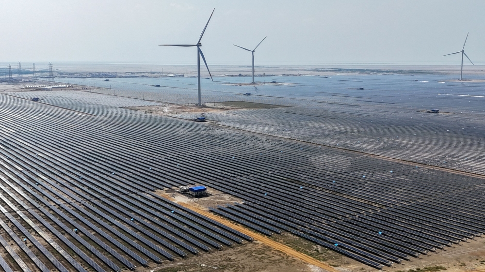 This aerial photograph taken on October 15, 2024 shows solar panels installed at the Adani Green Renewable Energy Plant in Khavda, in India's Gujarat state. India, along its desolate border with Pakistan, is building what it boasts will be the world’s largest renewable power plant, an emblem of a determined push to boost solar energy. — AFP pic