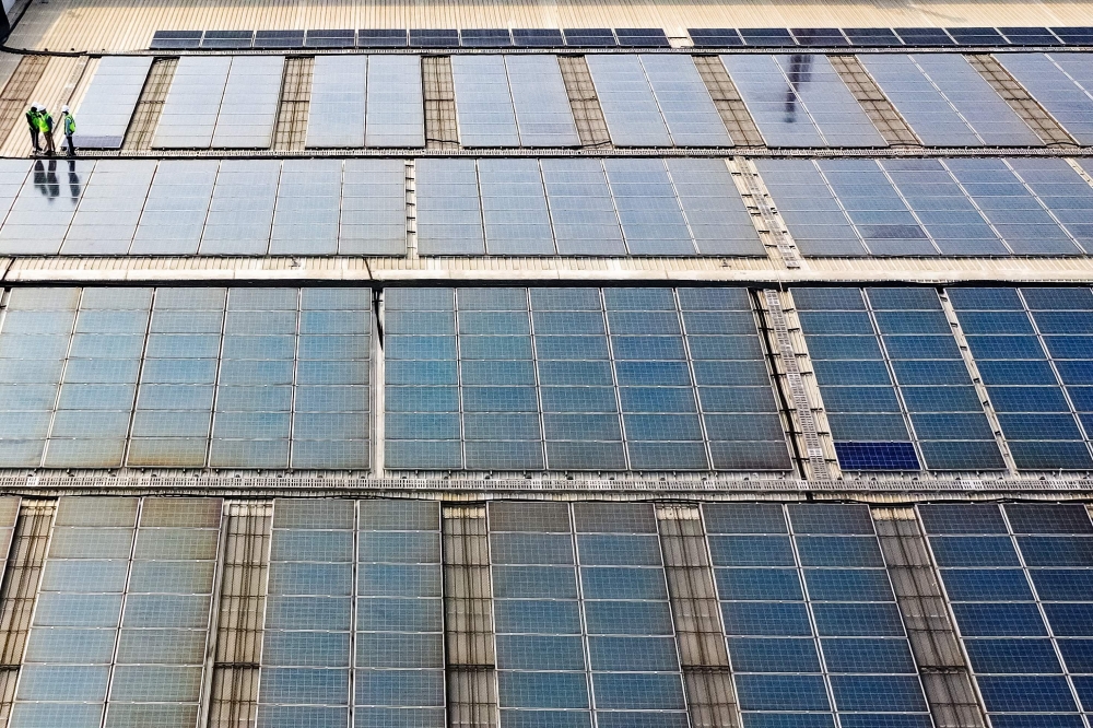 This photograph taken on November 21, 2024 shows an aerial view of solar panels installed by SunSource Energy at a food processing plant of the Indian food service company Jubilant FoodWorks in Greater Noida. — AFP pic