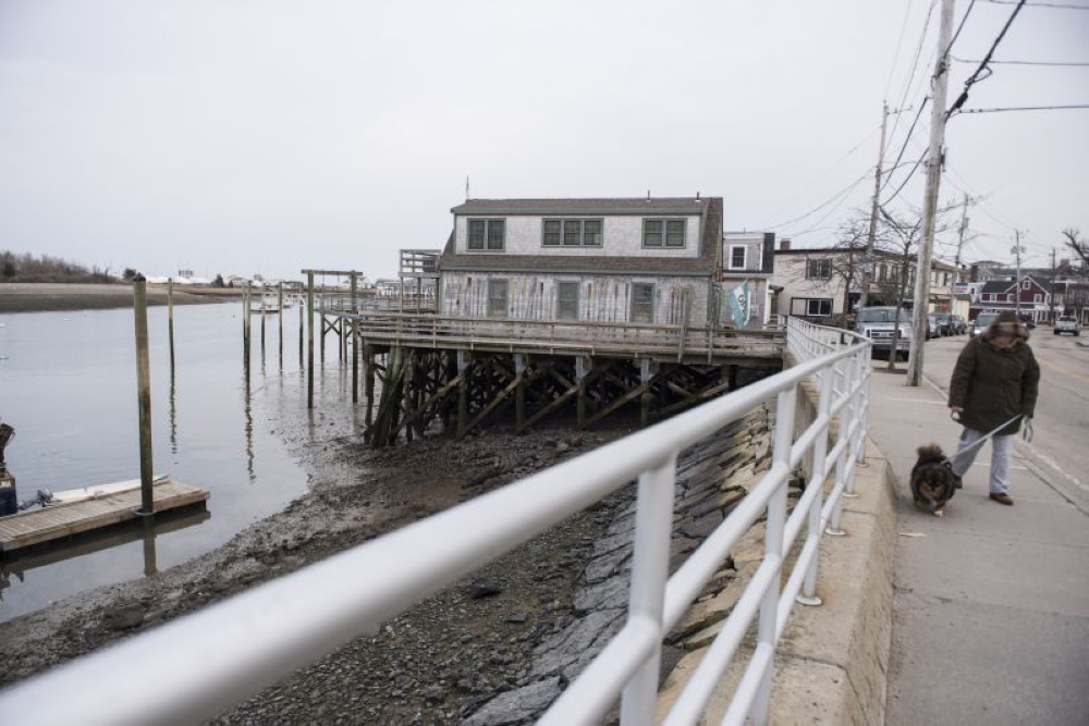 Low tide waters are seen yesterday (March 1) evening as residents are boarding up and sand bagging their properties as a storm known as a ‘bomb cyclone’ makes it way to the East Coast in Scituate, Massachusetts. — AFP pic 