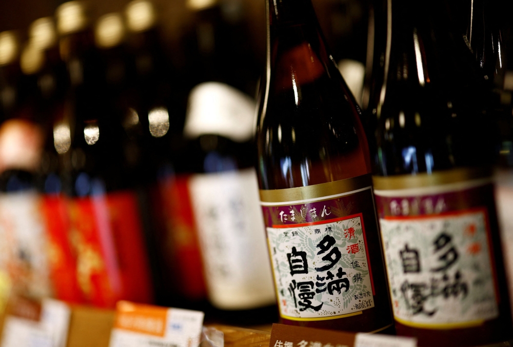 ‘Tamajiman’ brand sake bottles produced by Ishikawa Shuzou, or Ishikawa Brewery, are displayed for sale at the brewery’s sales store in Fussa, western portion of Tokyo, November 25, 2024. — Reuters pic