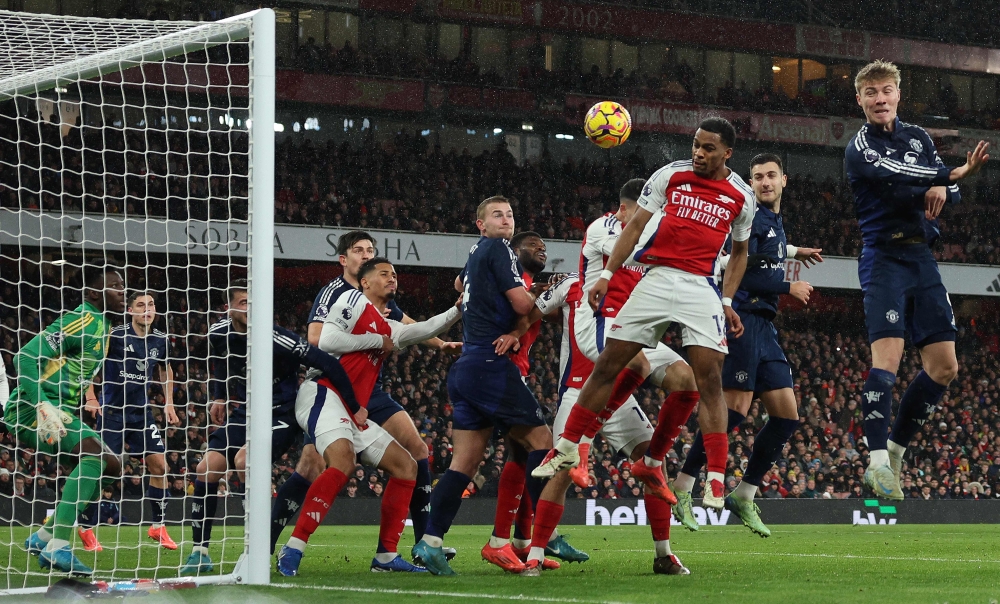 Arsenal's Dutch defender #12 Jurrien Timber scores the opening goalduring the English Premier League football match between Arsenal and Manchester United at the Emirates Stadium in London December 4, 2024. — AFP pic