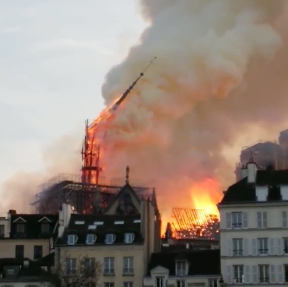 The Notre-Dame Cathedral spire collapses during a fire in Paris April 15, 2019 in this still image taken from social media video. — Reuters pic