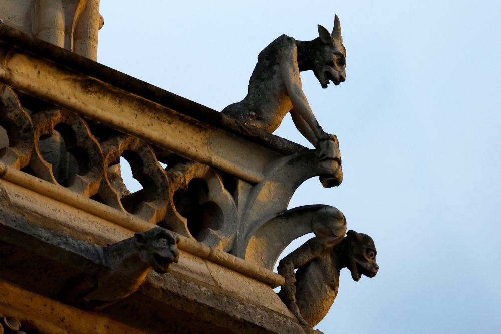 A view of gargoyles adorning the Notre-Dame de Paris Cathedral, five-and-a-half years after a fire ravaged the Gothic masterpiece, on the eve of reopening ceremonies in Paris December 6, 2024. — Reuters pic  