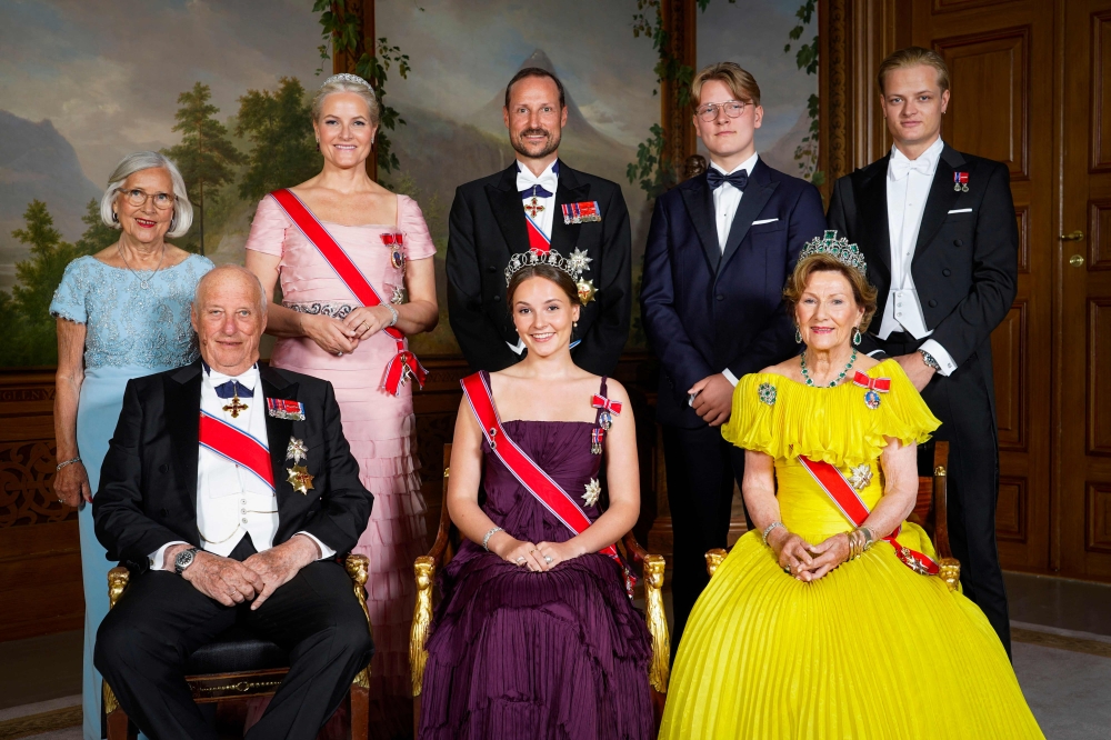 Norway's Princess Ingrid Alexandra (front, centre) poses for a family photo with (front, from left) Norway's King Harald V and Norway's Queen Sonja and (back, from left) Marit Tjessem, Norway's Crown Princess Mette-Marit, Norway's Crown Prince Haakon, Norway's Prince Sverre Magnus and Marius Borg Hoiby on the occasion of a gala dinner for her 18th birthday in Oslo June 17, 2022. — Lise Serud/NTB/AFP pic