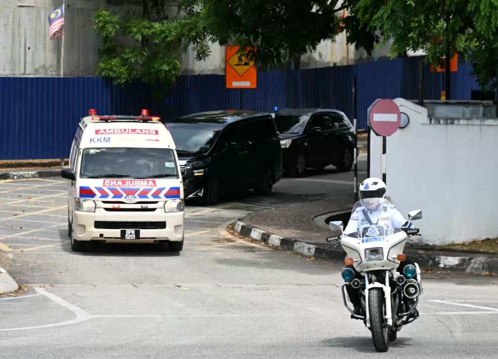 The convoy believed to carry Norway's King Harald V leaves Sultanah Maliha Hospital to Langkawi International Airport on the Malaysian resort island of Langkawi on March 3, 2024, after an infection forced him to be hospitalised while on holiday. — AFP pic