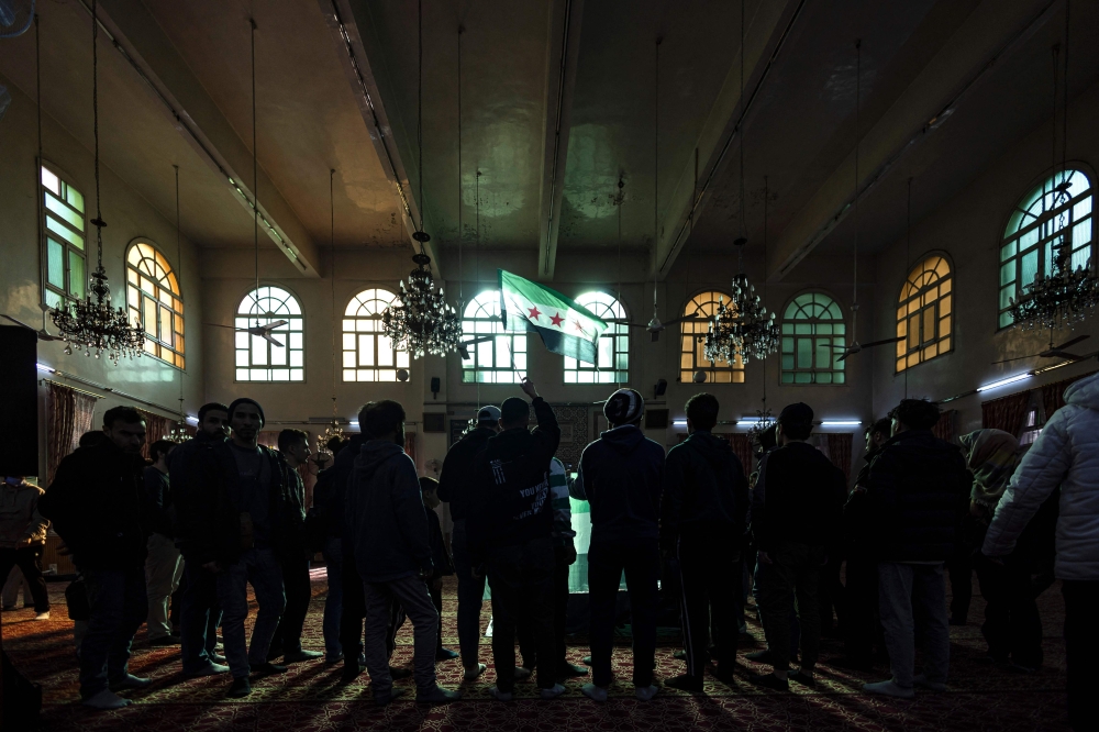 Mourners gather in a mosque around the coffin of Syrian activist Mazen al-Hamada, whose body was found recently, during his funeral in the capital Damascus on December 12, 2024. Hamada's body was found in Harasta Hospital after Syrian rebels took control of Damascus in a lightning advance. — AFP pic