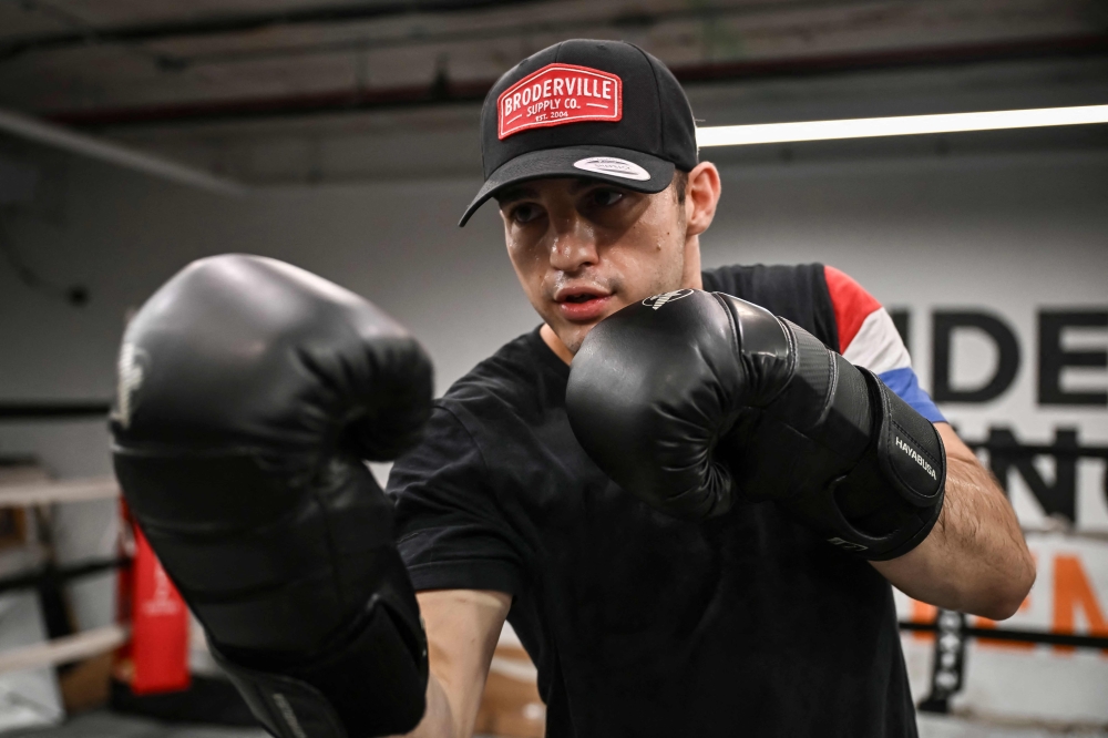 Boxer Pierre-Mickael Hugues trains with professional boxer Christophe Mendy at Mendez Boxing Gym Harlem December 5, 2024 in New York City. Hugues, an accomplished amateur boxer, crossed the Atlantic at the end of November for his first tour to make a name for himself in the US where boxing is king. — AFP pic