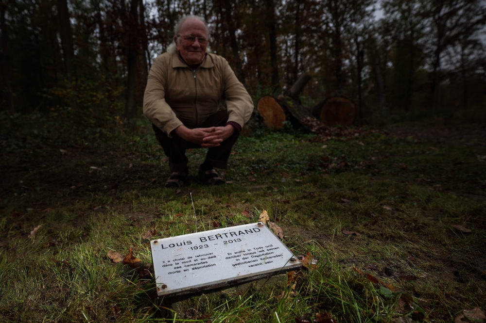 Jean-Louis Bertrand, son of the French Nazi concentration camp survivor Louis Bertrand (1923 - 2013), looks at his father's grave at the ‘Langenstein-Zwieberge Concentration Camp Memorial’ on November 7, 2024 near Halberstadt, eastern Germany. — AFP pic