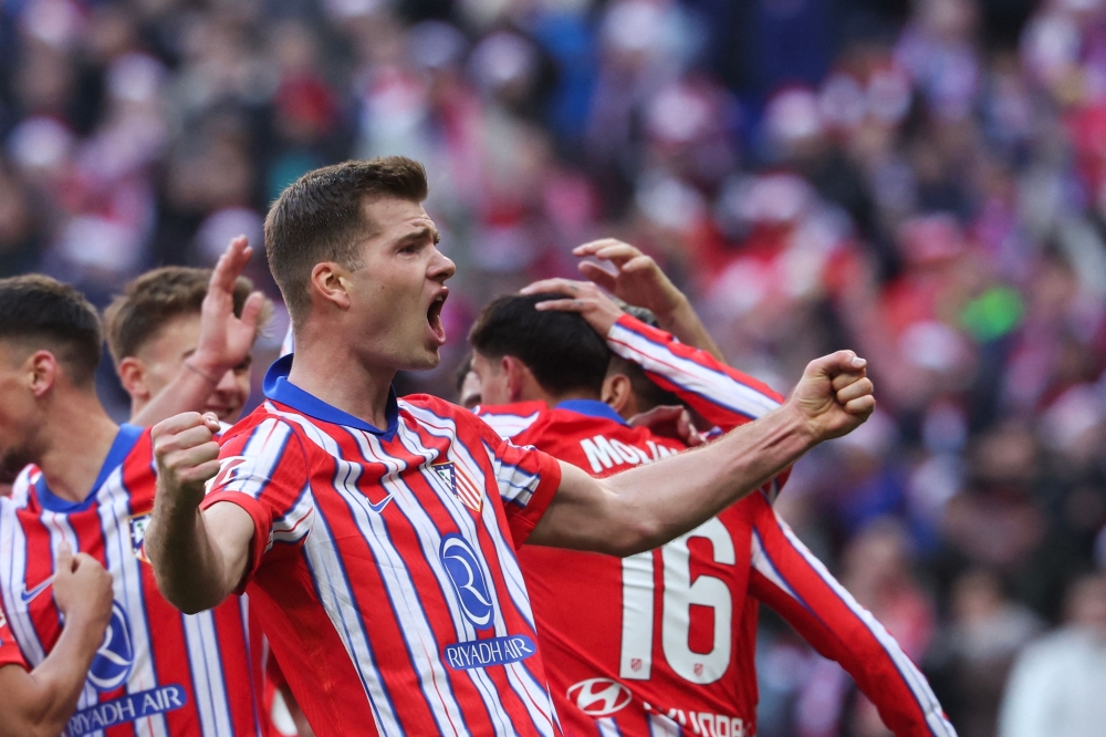 Atletico Madrid's forward Alexander Sorloth celebrates after scoring their first goal during the Spanish league football match between Club Atletico de Madrid and Getafe CF at the Metropolitano stadium in Madrid on December 15, 2024. — AFP pic