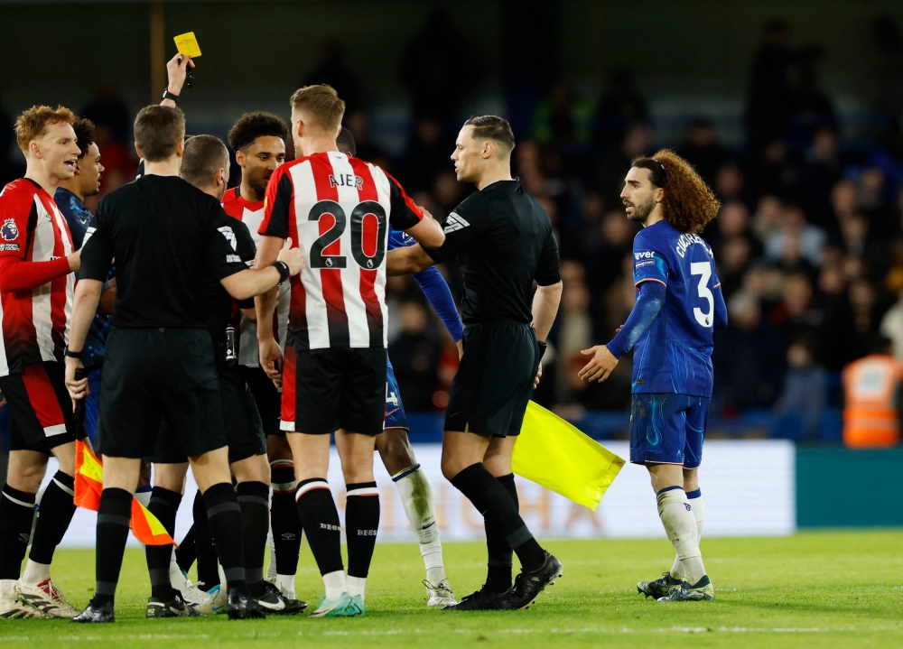 Chelsea's Marc Cucurella is shown a second yellow card by referee Peter Bankes before being sent off. — Reuters pic