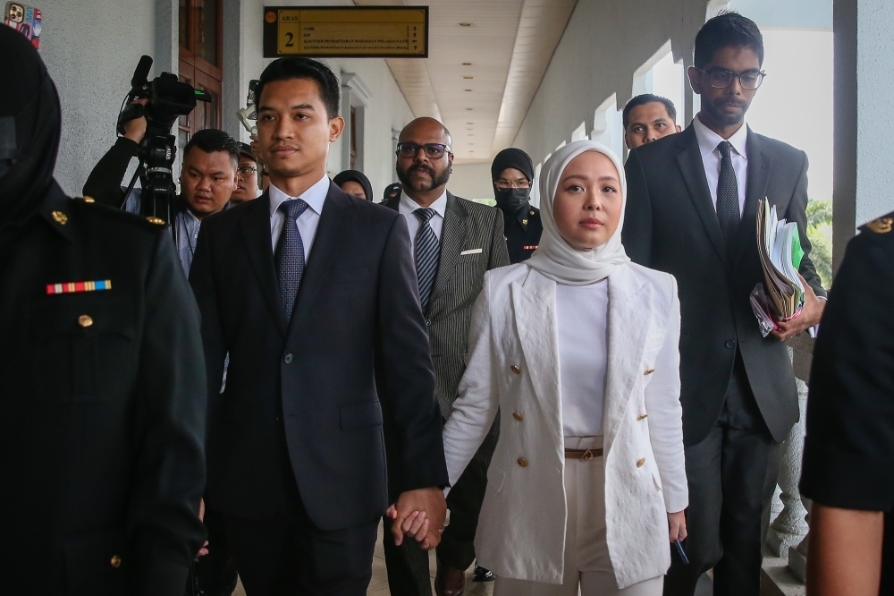 FashionValet Sdn Bhd founder Datin Vivy Yusof and her husband, Datuk Fadzarudin Shah Anuar, at the Kuala Lumpur High Court December 5, 2024. — Picture by Yusof Mat Isa