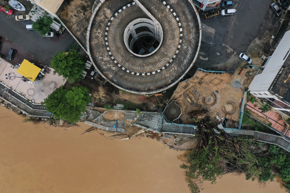 The landslide area near a riverbank, close to an apartment and accommodation centre, in Kota Baru December 16, 2024. — Bernama pic