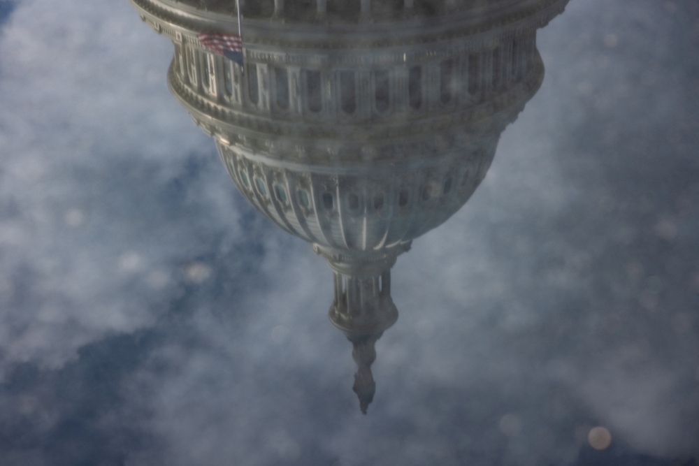 The US Capitol is reflected after President-elect Donald Trump called on US lawmakers to reject a stopgap bill to keep the government funded past Friday, raising the likelihood of a partial shutdown, on Capitol Hill in Washington December 19, 2024. — Reuters pic  