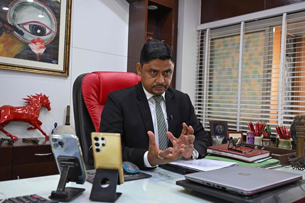 In this photograph taken on December 4, 2024, Sanjay Singh, who runs the Indian Detective Agency Pvt. Ltd. (IDAPL), speaks during an interview with AFP at his office in New Delhi. — AFP pic