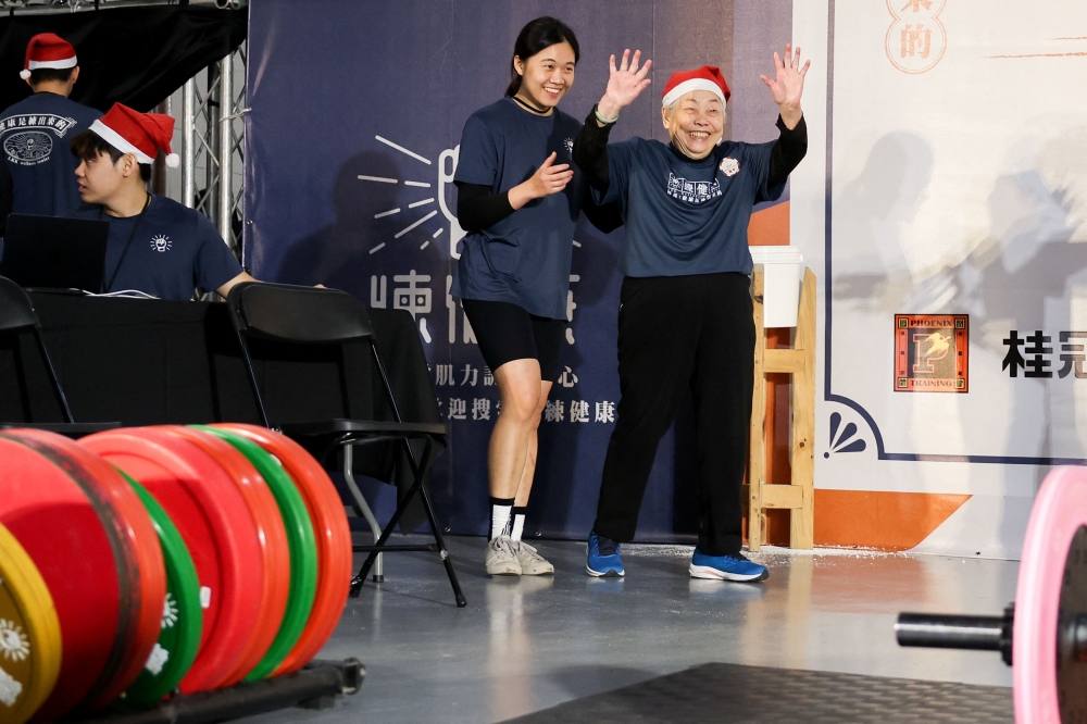 Cheng Chen Chin-Mei, 90, waves to the crowd. — Reuters pic