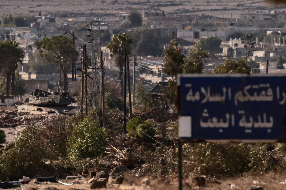 An Israeli army tank takes position in the Syrian town of Madinat al-Baath, in the UN-patrolled buffer zone in the Israeli-annexed Golan Heights on December 20, 2024. — AFP pic