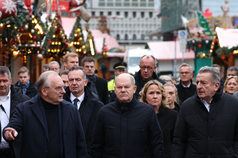 The German government faced growing questions Sunday about whether more could have been done to prevent the Christmas market car-ramming attack that killed five people and injured over 200. — AFP pic