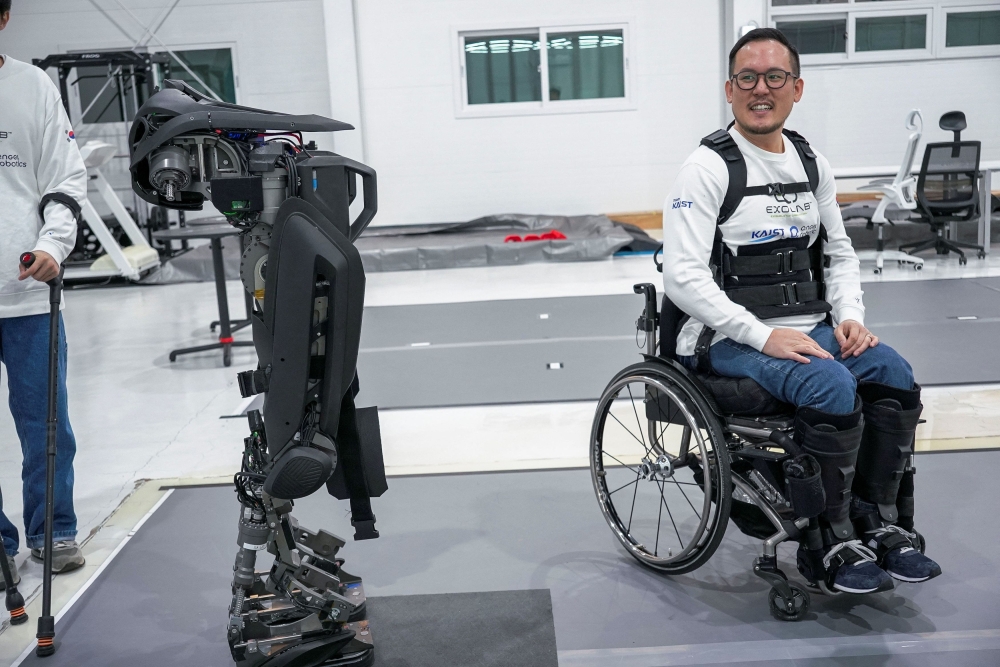 Kim Seung-hwan is himself a paraplegic and part of the Exoskeleton Laboratory team at the Korea Advanced Institute of Science and Technology (KAIST). — Reuters pic