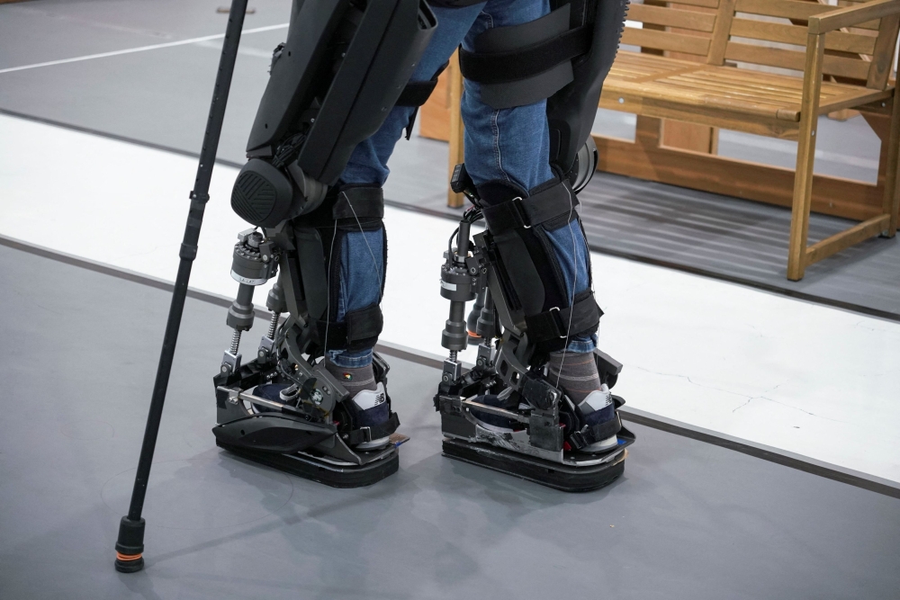 The robot is equipped with sensors on its soles and in the upper body that monitor 1,000 signals per second and anticipate the user’s intended movements. — Reuters pic