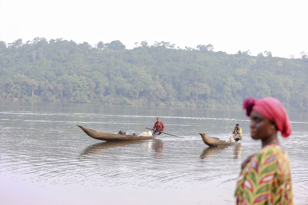 Fishermen bring their pirogues to the shores of Lake Ossa to sell their fish, in Dizangue, on December 11, 2024. — AFP pic