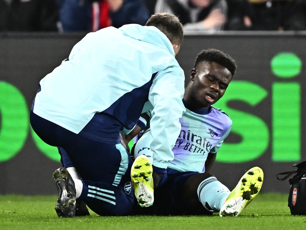 Arsenal’s Bukayo Saka receives medical attention after sustaining an injury during the Premier League match between Crystal Palace and Arsenal at Selhurst Park, London December 21, 2024. — Reuters pic  