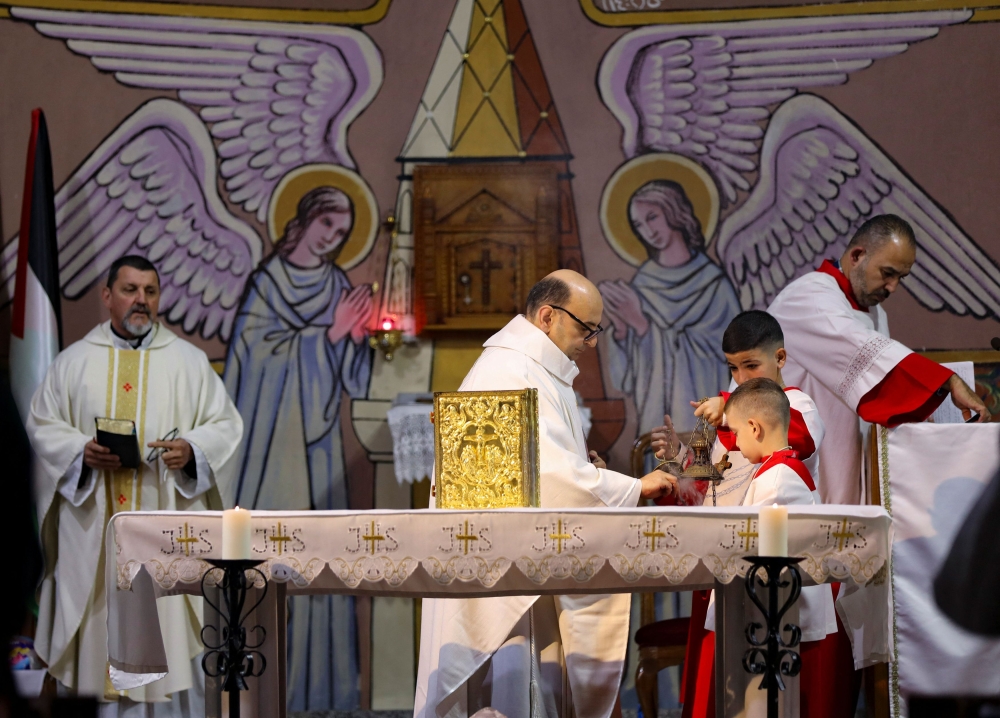 A priest holds a mass on Christmas Eve, amid the Israel-Hamas conflict, at the Holy Family Church in Gaza City, December 24, 2024. — Reuters pic  