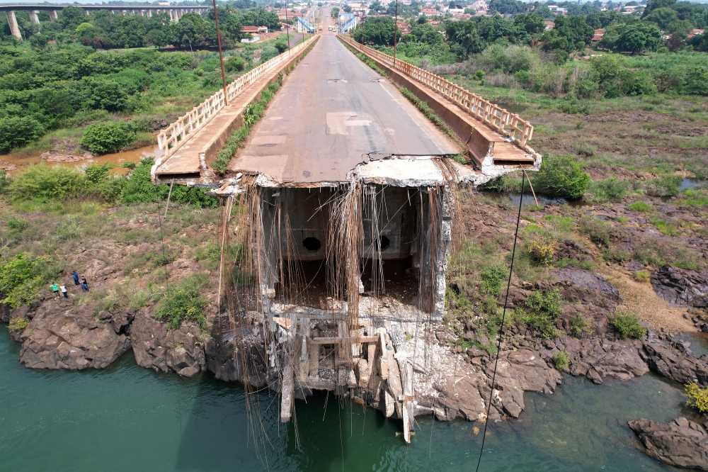 A drone view shows a collapsed bridge between Aguiarnopolis and Estreito, Brazil December 24, 2024. The day before the collapse, a local man had published an online video showing visible cracks in the bridge and warning that there was imminent danger. — Reuters pic