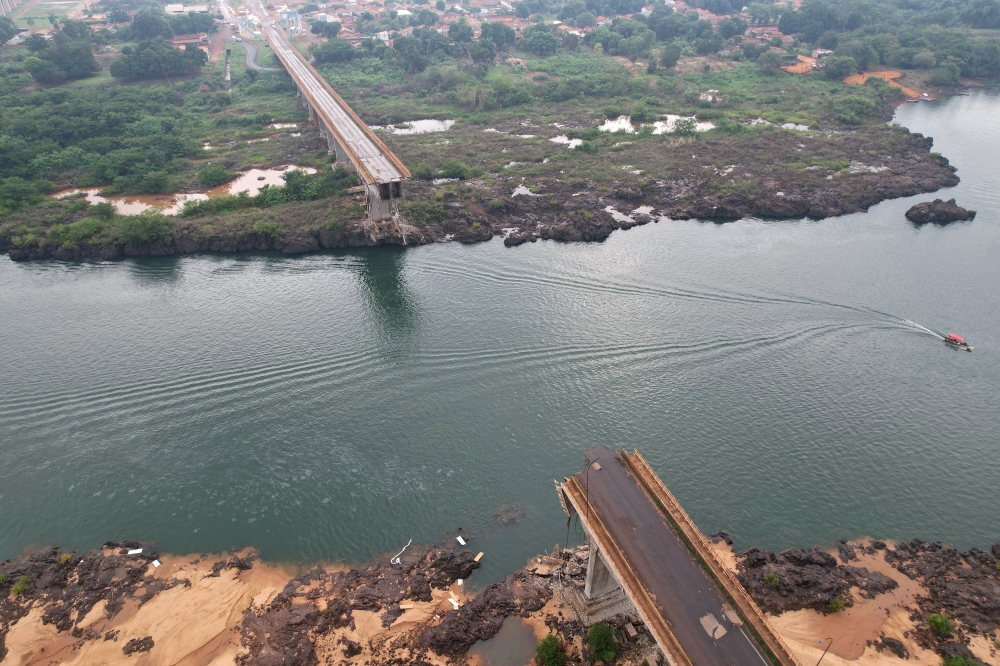 A drone view shows a collapsed bridge between Aguiarnopolis and Estreito, Brazil December 24, 2024. — Reuters pic