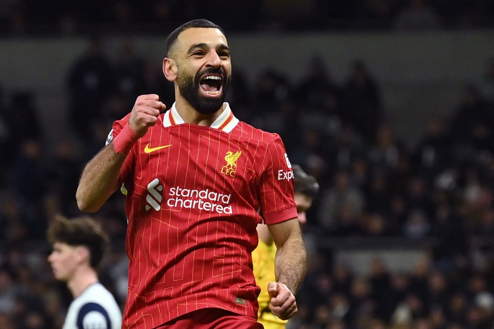 Liverpool’s Mohamed Salah celebrates after scoring their fifth goal during the English Premier League match with Tottenham Hotspur at the Tottenham Hotspur Stadium in London December 22, 2024. — AFP pic