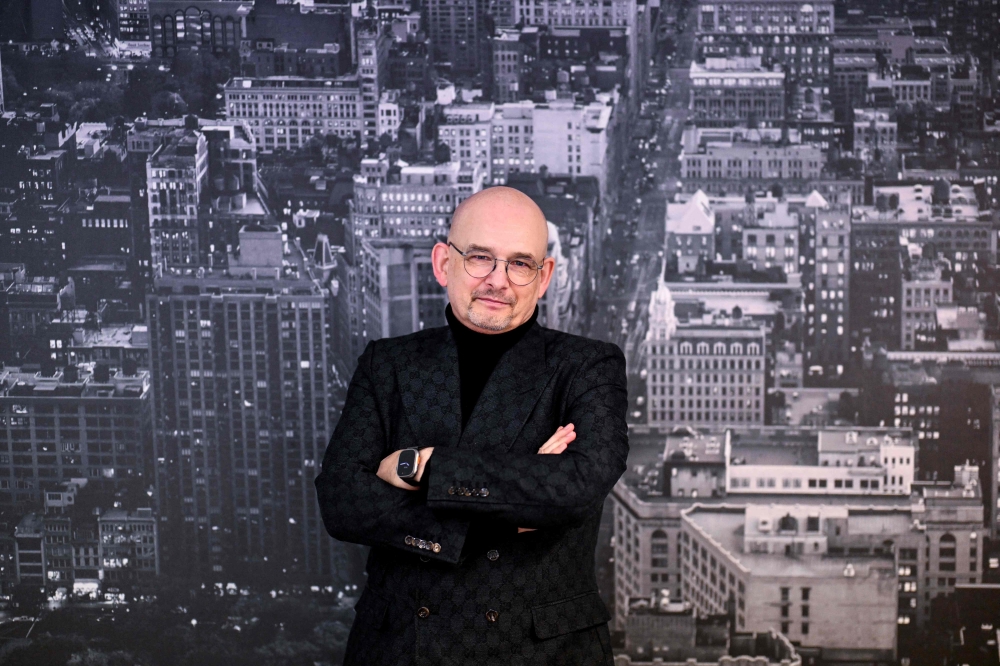 Private detective Marcus Lentz poses for photos in his office in Hanau December 20, 2024. — AFP pic