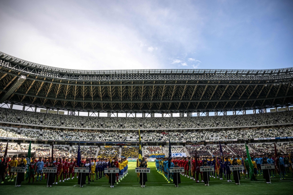 Japan’s national high school football tournament is thriving after more than 100 years, attracting huge crowds, millions watching on TV and breeding future stars, despite professional clubs trying to lure away young talent. — AFP pic