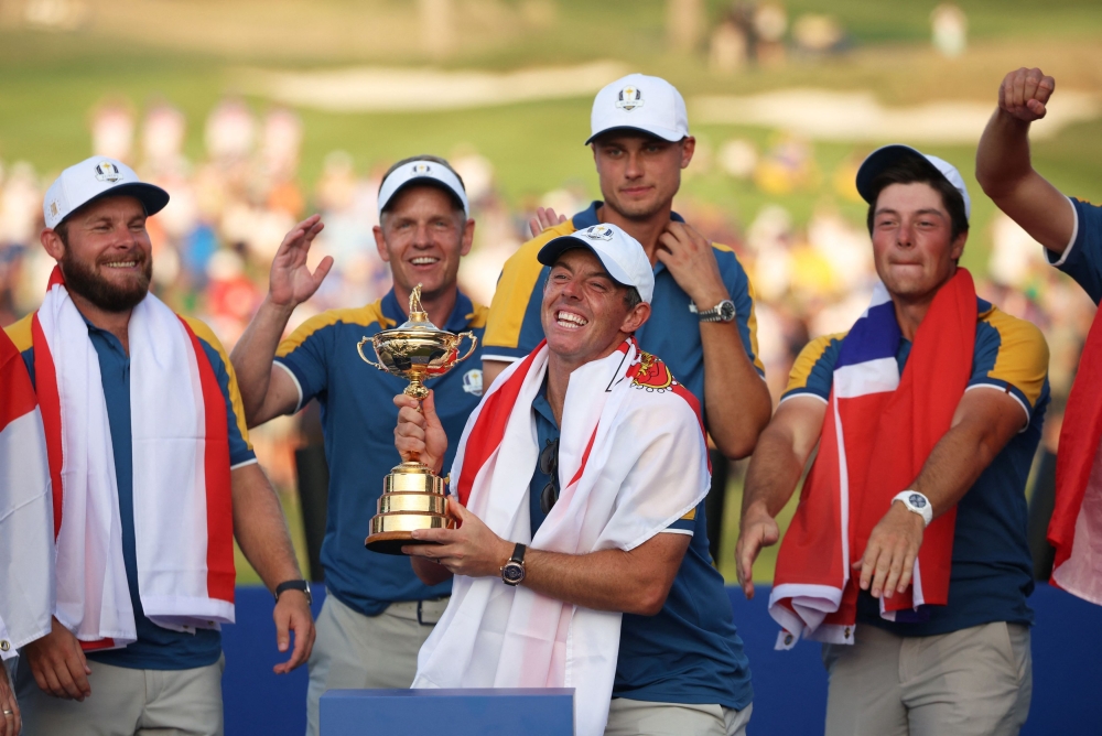 Team Europe's Rory McIlroy celebrates with the trophy and teammates during the presentation after winning the Ryder Cup in Rome in this file picture on October 1, 2023. — Reuters pic