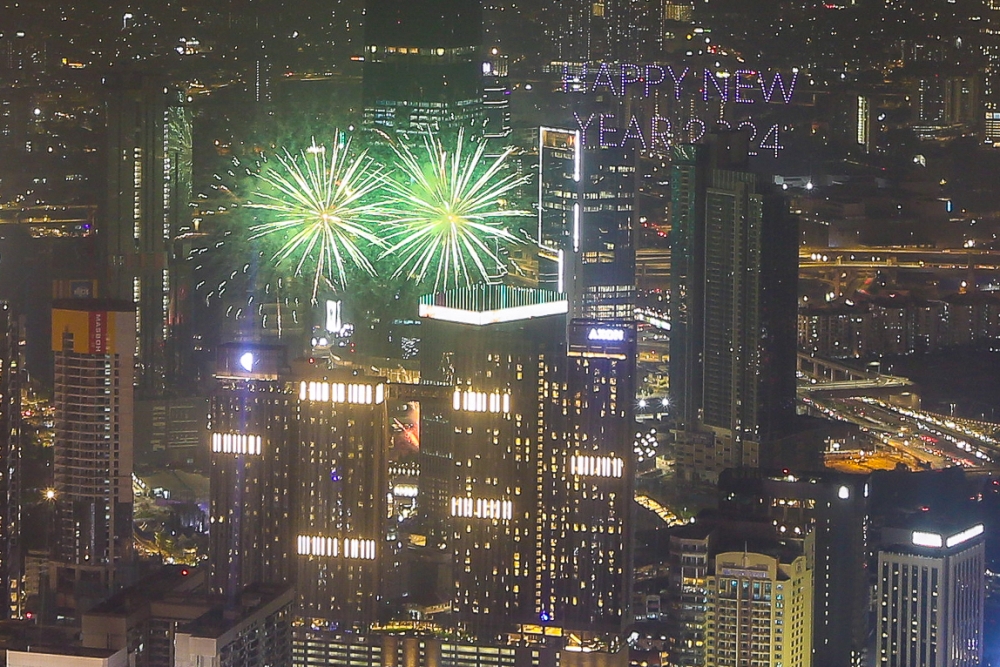 A New Year’s Eve fireworks display is photographed near the Tun Razak Exchange in Kuala Lumpur on January 1, 2024. — Picture by Yusof Mat Isa