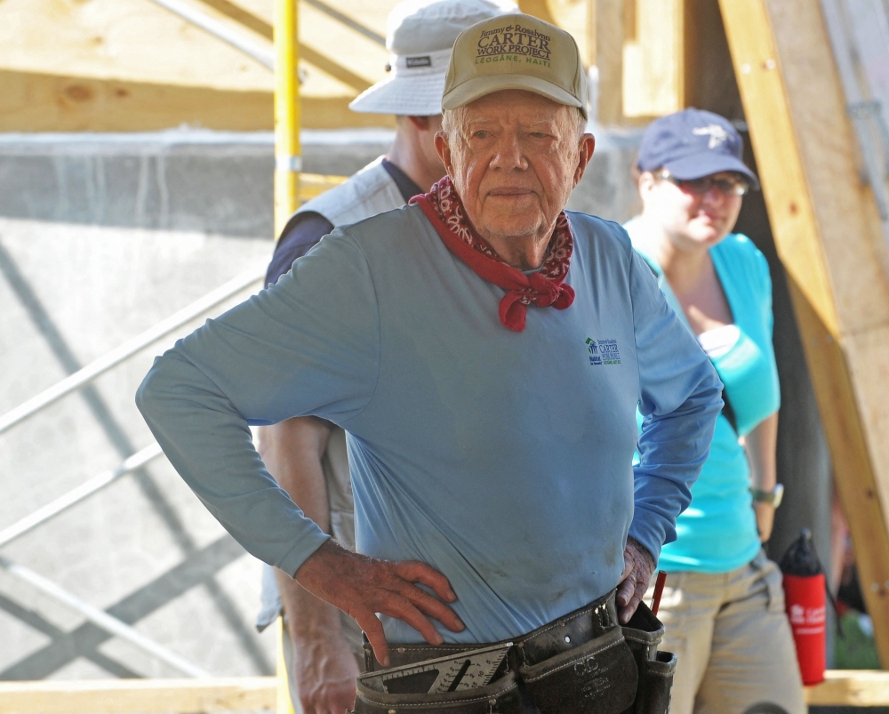 File photo of former US president Jimmy Carter visiting a construction site of houses being built by Carter's Habitat for Humanity foundation for victims of the January 2010 earthquake in Leogane, south of Port-au-Prince, Haiti, in, 2012.  — AFP