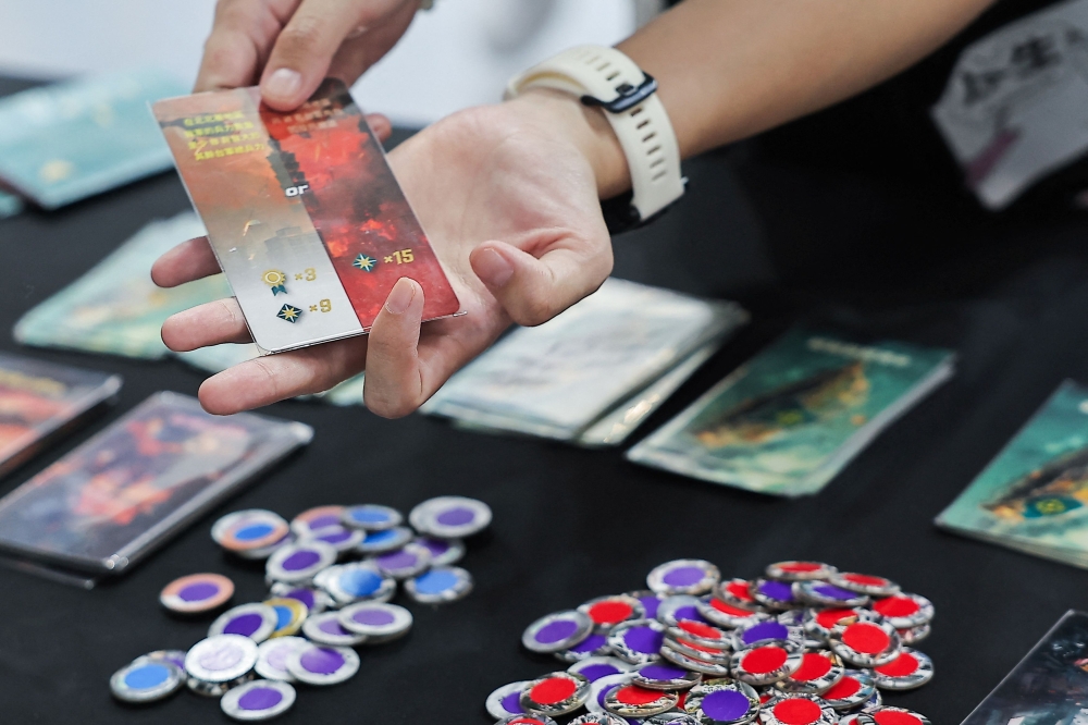 A player tests ‘2045’, a new board game by Mizo Games set against the backdrop of armed conflicts around Taiwan, in Taipei September 22, 2024. — Reuters pic  