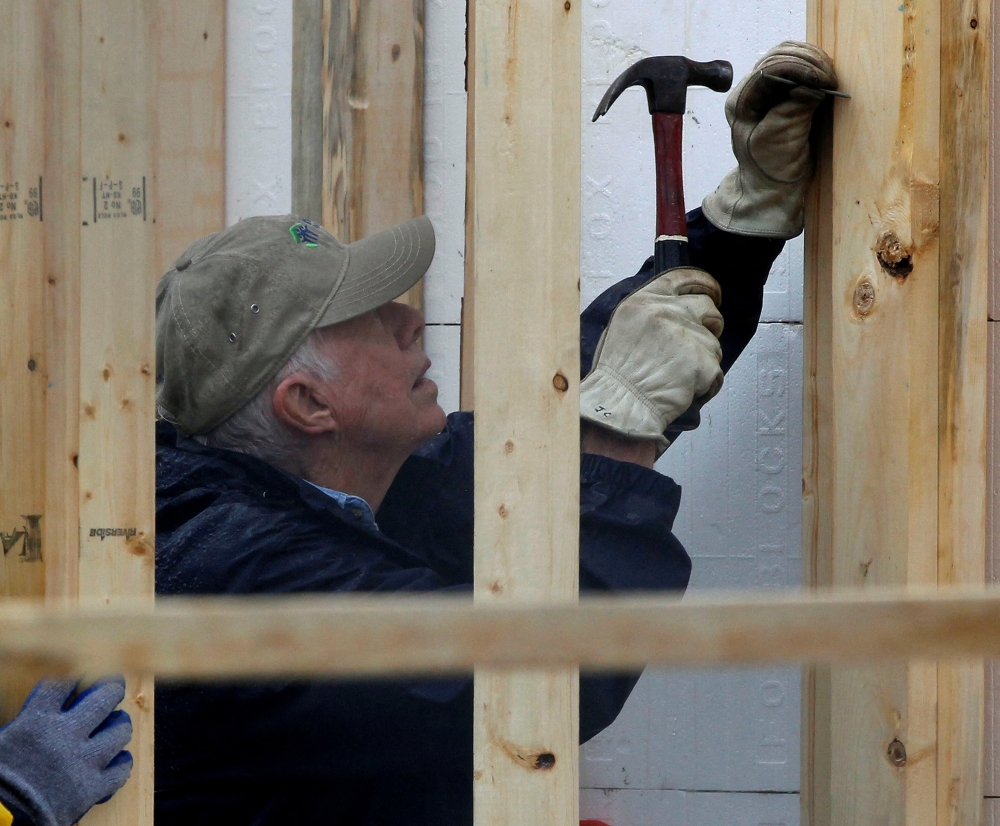 Former US President Jimmy Carter attends a Habitat for Humanity home building site in the Ivy City neighbourhood of Washington October 4, 2010. — Reuters pic