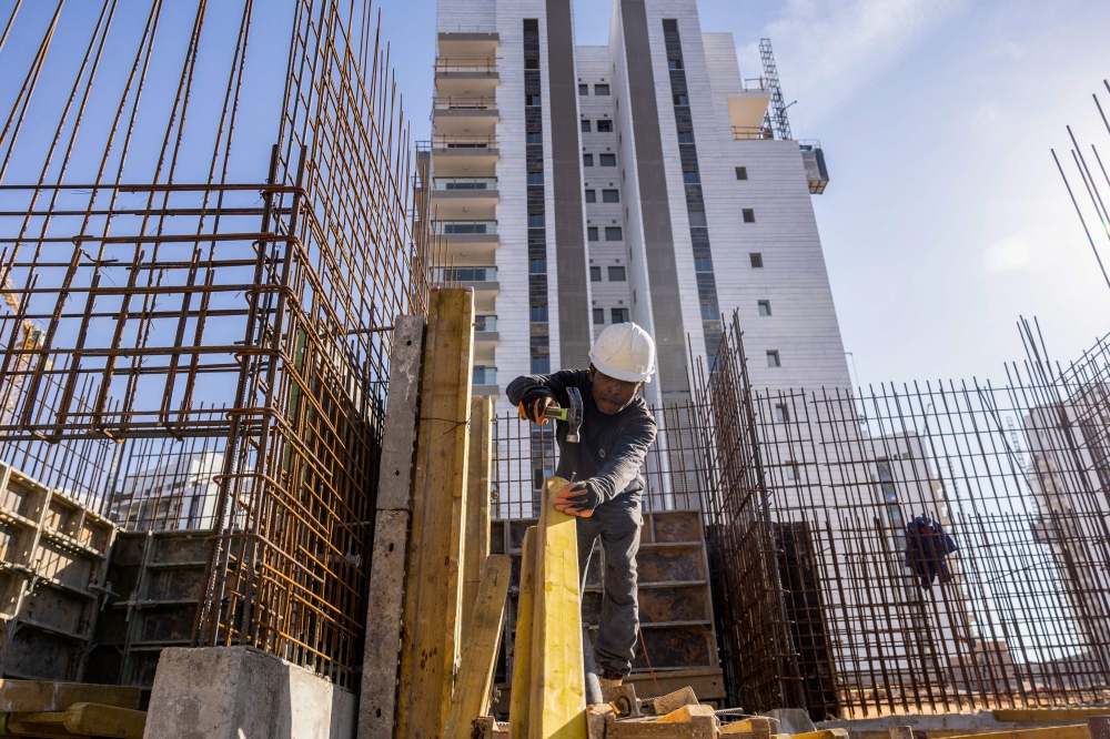 Indian labourers are relative newcomers to Israel’s building industry. — AFP pic